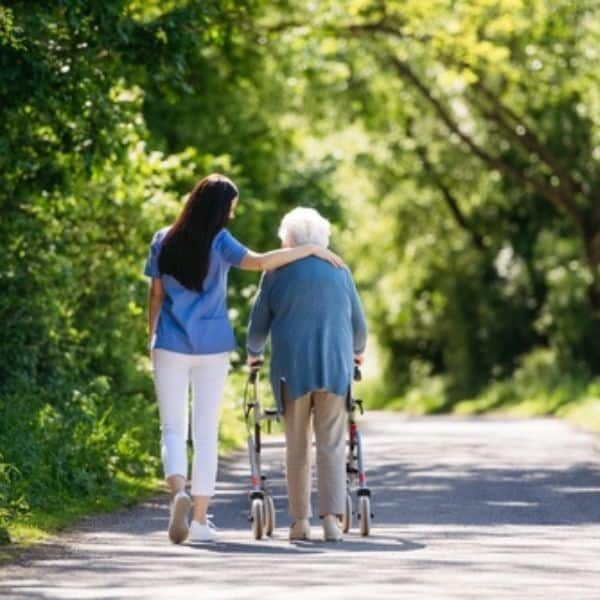End of LIfe Doula Walking with Elderly Woman